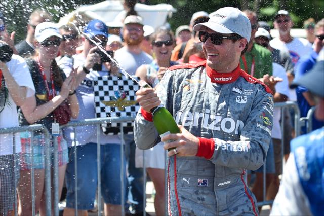 Will Power sprays the champagne in Victory Lane following his win in the KOHLER Grand Prix of Road America -- Photo by: Chris Owens