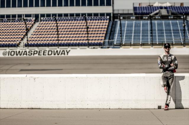 Alexander Rossi waits along pit lane prior to practice for the Iowa Corn 300 at Iowa Speedway -- Photo by: Shawn Gritzmacher