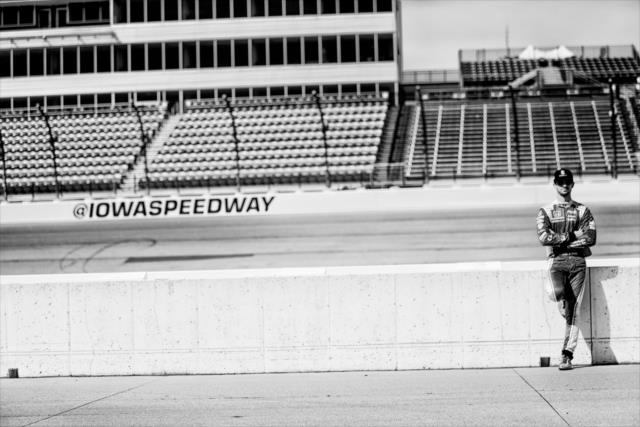 Alexander Rossi waits along pit lane prior to practice for the Iowa Corn 300 at Iowa Speedway -- Photo by: Shawn Gritzmacher
