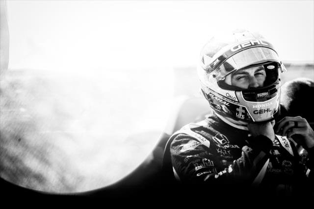 Graham Rahal straps on his helmet prior to practice for the Iowa Corn 300 at Iowa Speedway -- Photo by: Shawn Gritzmacher