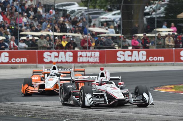 Helio Castroneves and Josef Newgarden sail out of Turn 5 during the KOHLER Grand Prix at Road America -- Photo by: Chris Owens