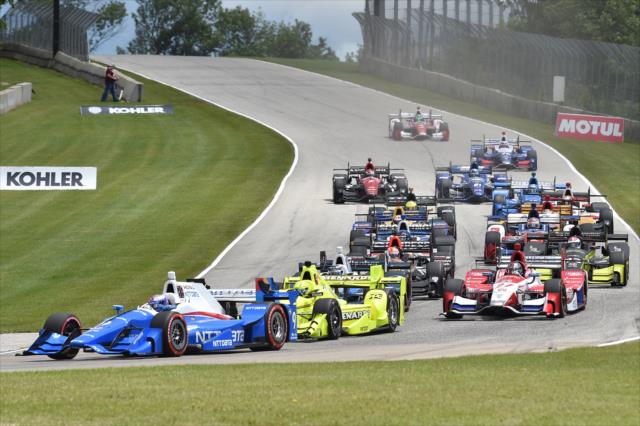 Scott Dixon leads the rest of the field into Turn 3 during the start of the KOHLER Grand Prix at Road America -- Photo by: Chris Owens