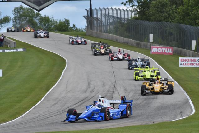 Scott Dixon leads the field into Turn 3 during the KOHLER Grand Prix at Road America -- Photo by: Chris Owens