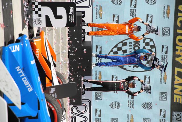 The podium of Scott Dixon, Josef Newgarden, and Helio Castroneves hoist their trophies in Victory Circle following the KOHLER Grand Prix at Road America -- Photo by: Matt Fraver
