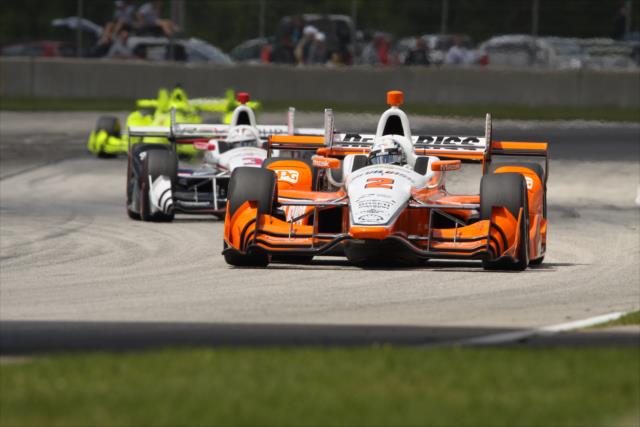 Josef Newgarden leads teammates Helio Castroneves and Simon Pagenaud toward Turn 9 during the KOHLER Grand Prix at Road America -- Photo by: Matt Fraver
