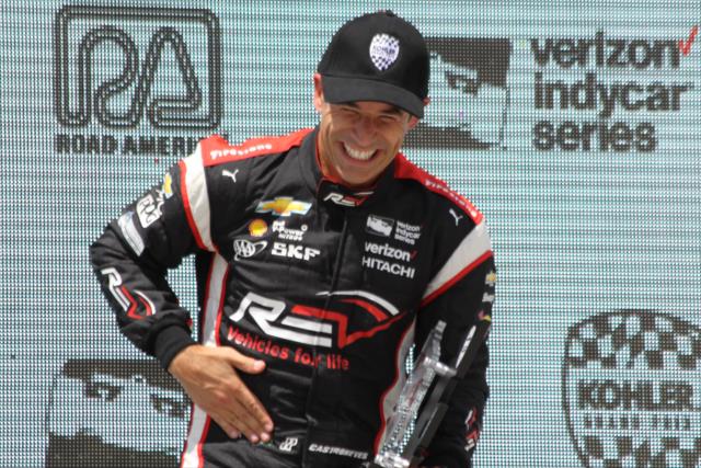 Helio Castroneves sports a smile in Victory Circle following his 3rd Place finish in the KOHLER Grand Prix at Road America -- Photo by: Matt Fraver