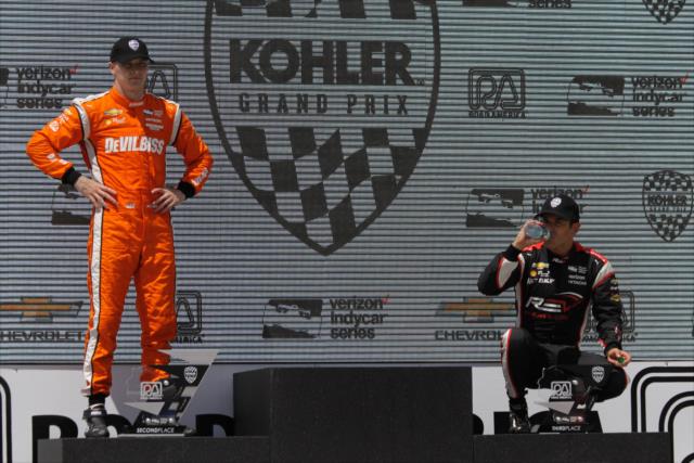 Josef Newgarden and Helio Castroneves on the Victory Circle podium following the KOHLER Grand Prix at Road America -- Photo by: Matt Fraver