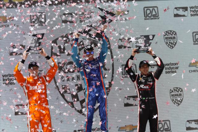 The confetti flies in Victory Circle for Scott Dixon, Josef Newgarden, and Helio Castroneves following the KOHLER Grand Prix at Road America -- Photo by: Matt Fraver