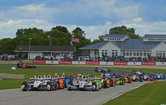 Helio Castroneves and Will Power lead the field down the frontstretch to start the KOHLER Grand Prix at Road America -- Photo by: Mike Harding