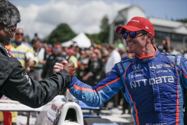 Scott Dixon gets congratulations from his crew in Victory Circle following his win in the KOHLER Grand Prix at Road America -- Photo by: Shawn Gritzmacher