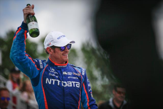 Scott Dixon toasts the crowd in Victory Circle following his win in the KOHLER Grand Prix at Road America -- Photo by: Shawn Gritzmacher