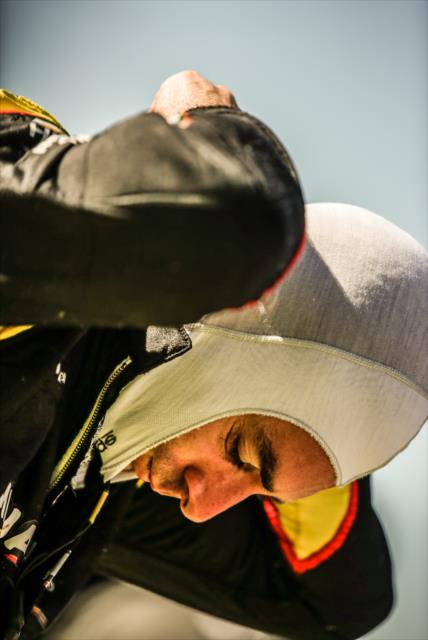 Simon Pagenaud adjusts his firesuit on pit lane prior to the final warmup for the KOHLER Grand Prix at Road America -- Photo by: Shawn Gritzmacher