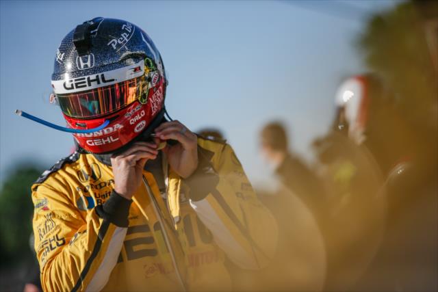 Graham Rahal straps on his helmet prior to the final warmup for the KOHLER Grand Prix at Road America -- Photo by: Shawn Gritzmacher