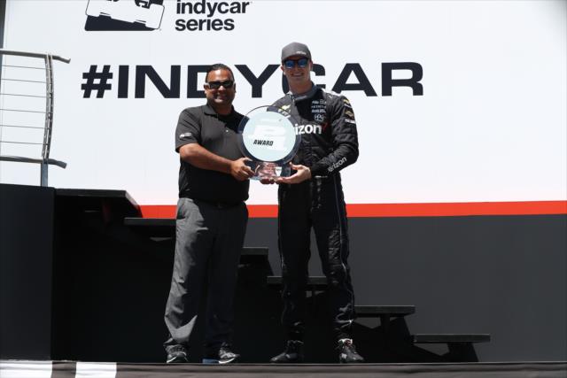 Josef Newgarden accepts the Verizon P1 Award for winning the pole position during pre-race festivities for the KOHLER Grand Prix at Road America -- Photo by: Chris Jones