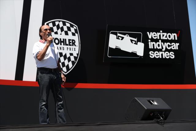 Music artist Lee Greenwood performs the National Anthem on stage during pre-race festivities for the KOHLER Grand Prix at Road America -- Photo by: Chris Jones
