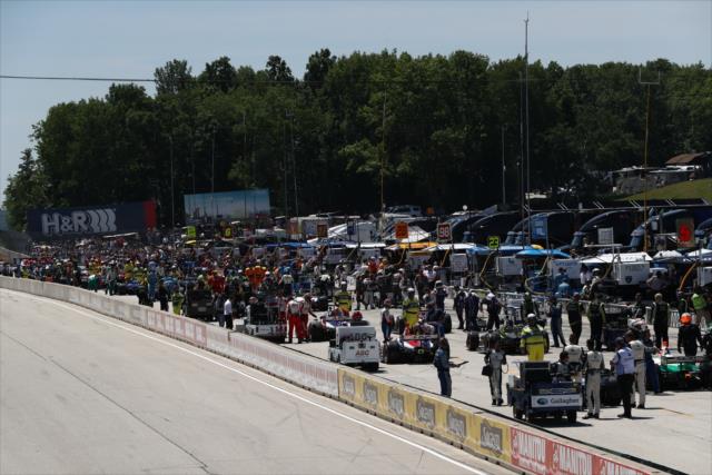 Pit lane comes to life as the cars are moved onto the grid during pre-race festivities for the KOHLER Grand Prix at Road America -- Photo by: Chris Jones