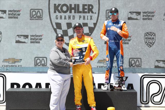 Ryan Hunter-Reay is presented his 2nd Place trophy in Victory Lane following the KOHLER Grand Prix at Road America -- Photo by: Chris Jones