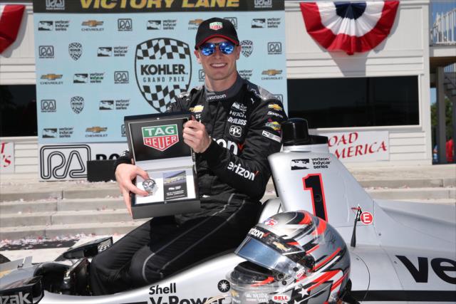 Josef Newgarden with his TAG Heuer's Winner's Watch in Victory Lane after winning the KOHLER Grand Prix at Road America -- Photo by: Chris Jones