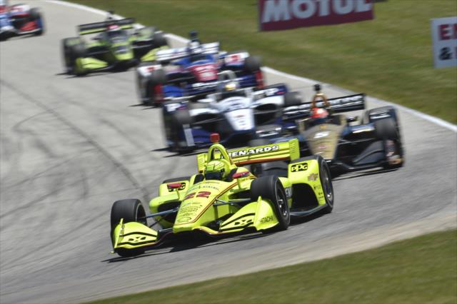 Simon Pagenaud leads a gaggle of cars into Turn 3 during the KOHLER Grand Prix at Road America -- Photo by: Chris Owens