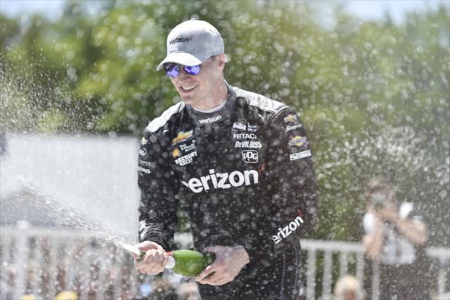 Josef Newgarden sprays the champagne in Victory Circle after winning the KOHLER Grand Prix at Road America -- Photo by: Chris Owens