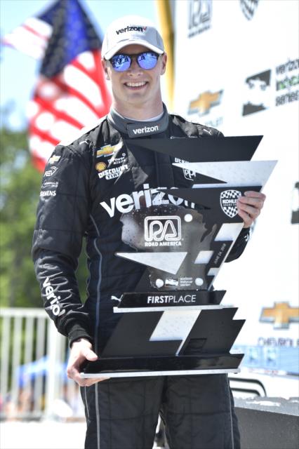 Josef Newgarden with his winner's trophy in Victory Circle after winning the KOHLER Grand Prix at Road America -- Photo by: Chris Owens