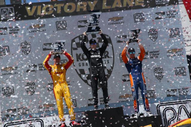 The podium of Josef Newgarden, Ryan Hunter-Reay, and Scott Dixon hoist their trophies in Victory Lane following the KOHLER Grand Prix at Road America -- Photo by: Matt Fraver