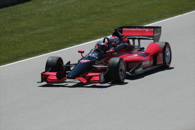 Arie Luyendyk Jr. pilots the two-seater down the fronstretch during the parade laps prior to the start of the KOHLER Grand Prix at Road America -- Photo by: Matt Fraver