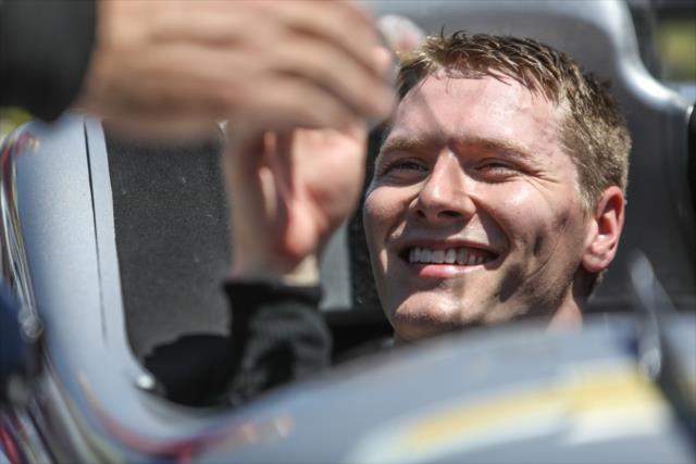 Josef Newgarden gets congratulations from his team in Victory Lane after winning the KOHLER Grand Prix at Road America -- Photo by: Shawn Gritzmacher