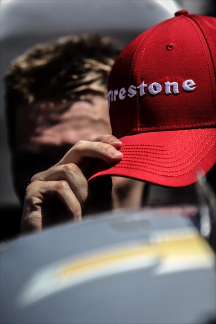 Josef Newgarden grabs the winner's Firestone hat in Victory Lane after scoring the win in the KOHLER Grand Prix at Road America -- Photo by: Shawn Gritzmacher