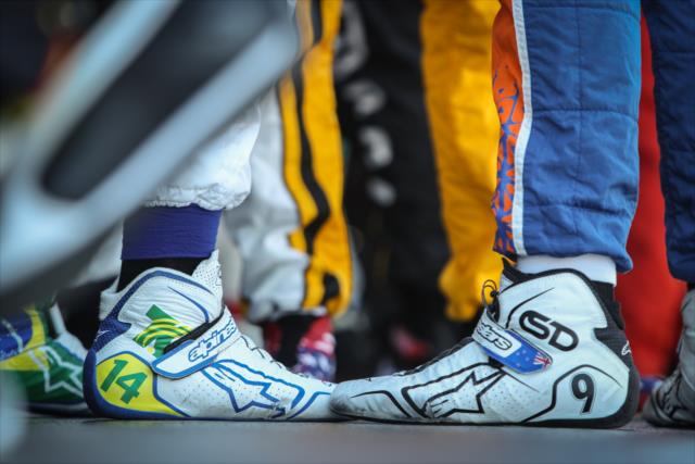 The shoes of Tony Kanaan (L) and Scott Dixon (R) as they chat backstage during pre-race festivities for the KOHLER Grand Prix at Road America -- Photo by: Shawn Gritzmacher