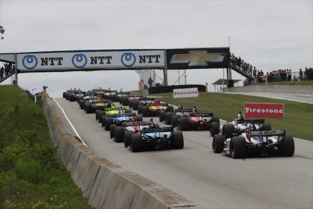 The field heads towards the start of the race. -- Photo by: Chris Jones