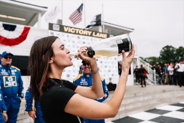 Kelly Mossop, Alexander Rossi's girl friend with the victory Champagne -- Photo by: Joe Skibinski