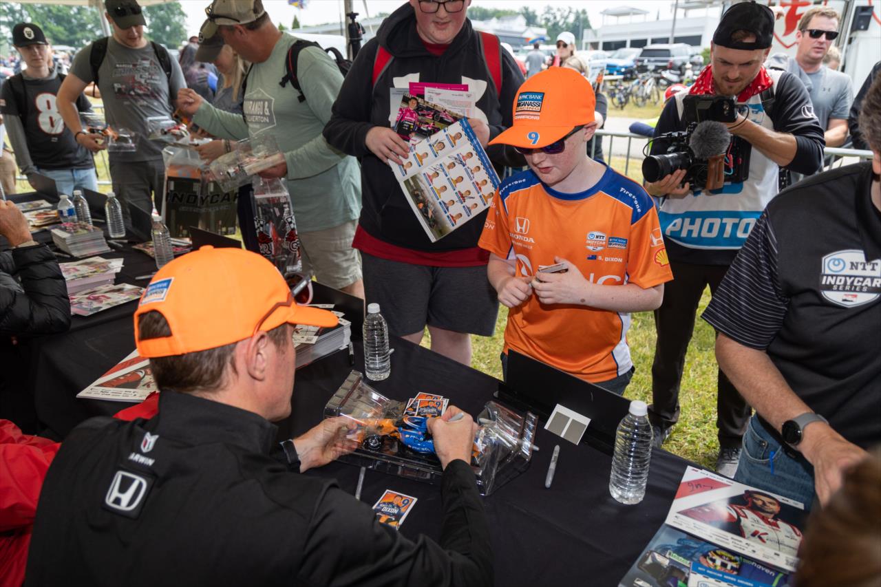 Scott Dixon signs an autograph for a fan - Sonsio Grand Prix at Road America - By: Travis Hinkle -- Photo by: Travis Hinkle