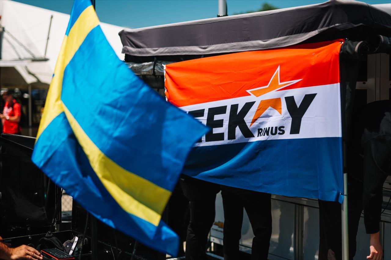 Marcus Ericsson with a Sweden flag pits next to Rinus VeeKay as he displays a flag representing the Netherlands - XPEL Grand Prix at Road America - By: Joe Skibinski -- Photo by: Joe Skibinski