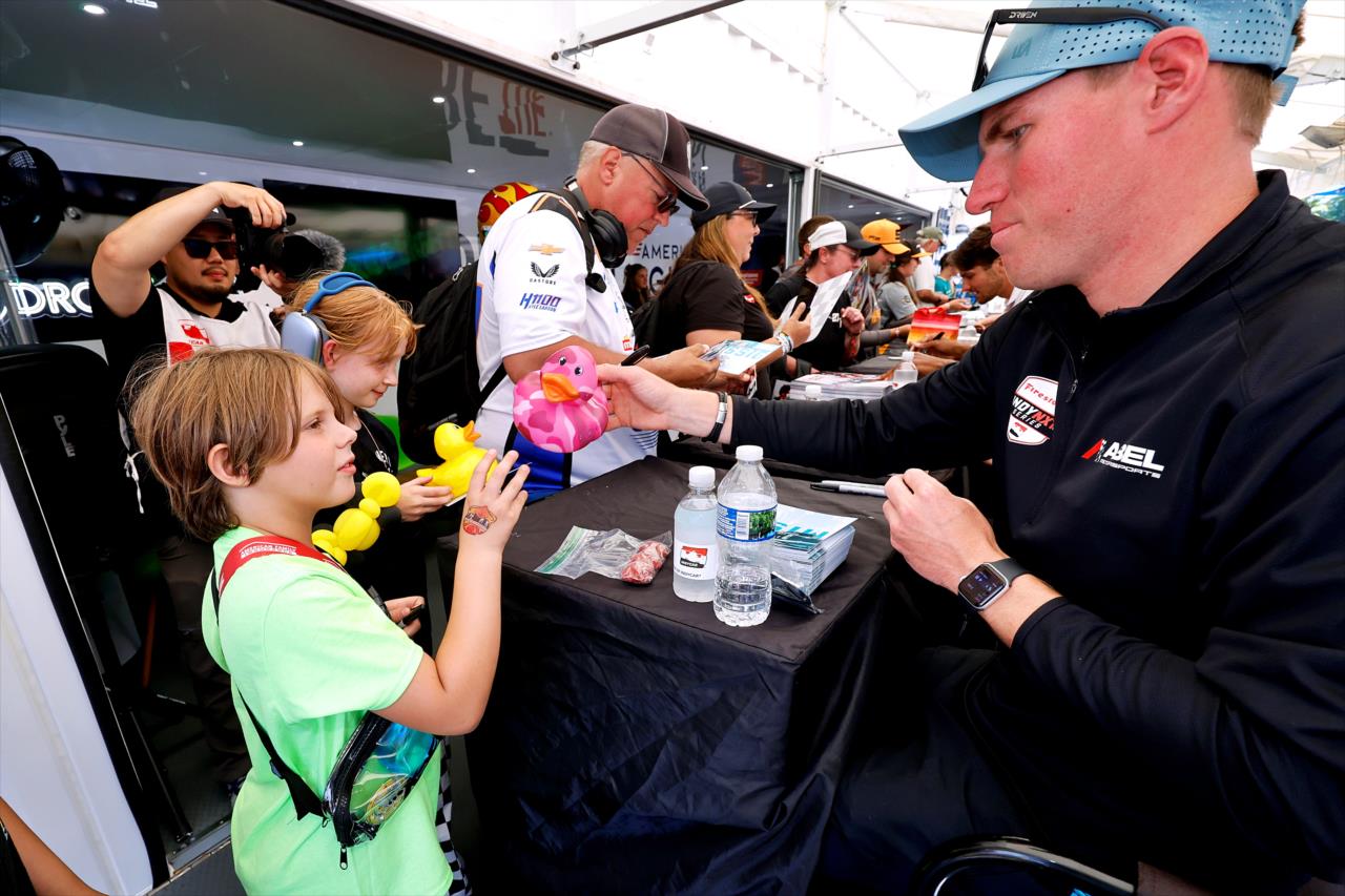 Jordan Missig with fan - Grand Prix at Road America - INDY NXT Presented by Firestone - By: Paul Hurley -- Photo by: Paul Hurley