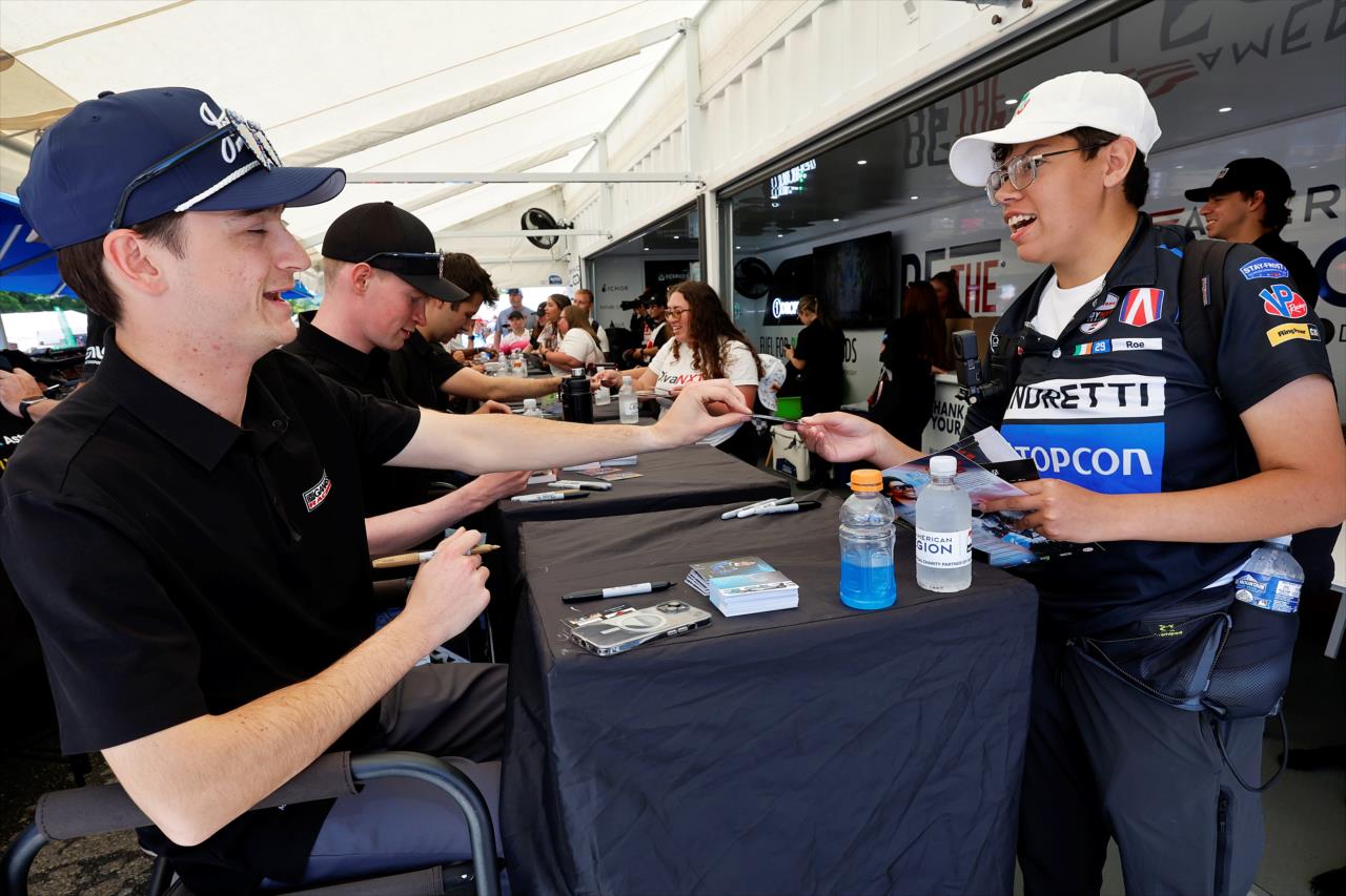 Carson Etter with a fan - Grand Prix at Road America - INDY NXT Presented by Firestone - By: Paul Hurley -- Photo by: Paul Hurley