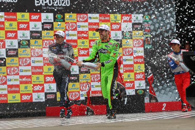 Champagne flies at the Sao Paulo Indy 300 podium -- Photo by: Chris Jones