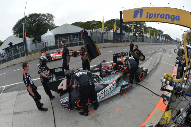 JR Hildebrand in the pits as Tristan Vautier flashes by -- Photo by: John Cote