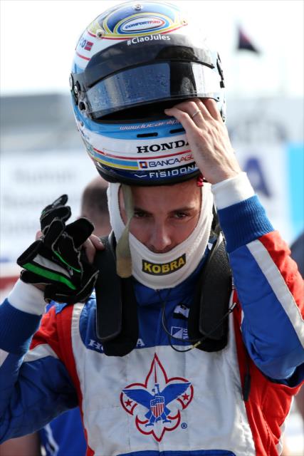Mikhail Aleshin slides on his helmet prior to practice for the Firestone Grand Prix of St. Petersburg -- Photo by: Chris Jones