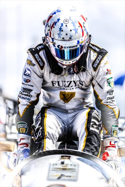 Josef Newgarden slides into his No. 21 Fuzzy's Vodka Chevrolet prior to practice for the Firestone Grand Prix of St. Petersburg -- Photo by: Shawn Gritzmacher