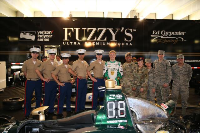 Spencer Pigot with members of MacDill Air Force Base Special Operations Command in the Ed Carpenter Racing paddock in St. Petersburg -- Photo by: Chris Jones