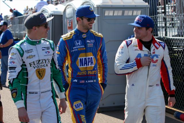 Spencer Pigot, Alexander Rossi, and Conor Daly walk pit lane prior to practice for the Firestone Grand Prix of St. Petersburg -- Photo by: Joe Skibinski