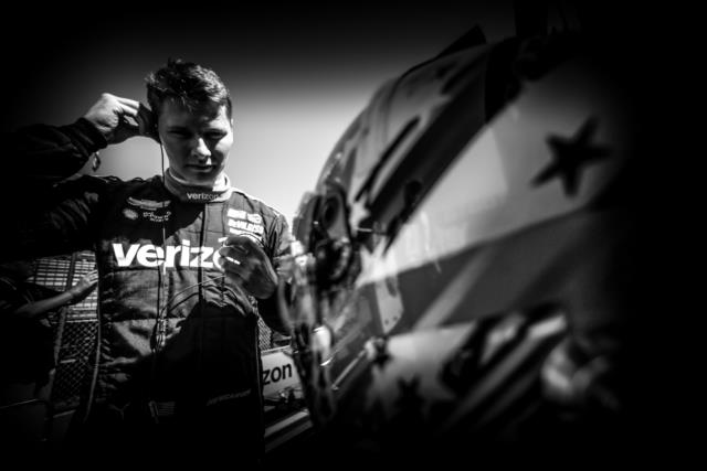 Josef Newgarden adjusts his earpieces along pit lane prior to practice for the Firestone Grand Prix of St. Petersburg -- Photo by: Shawn Gritzmacher