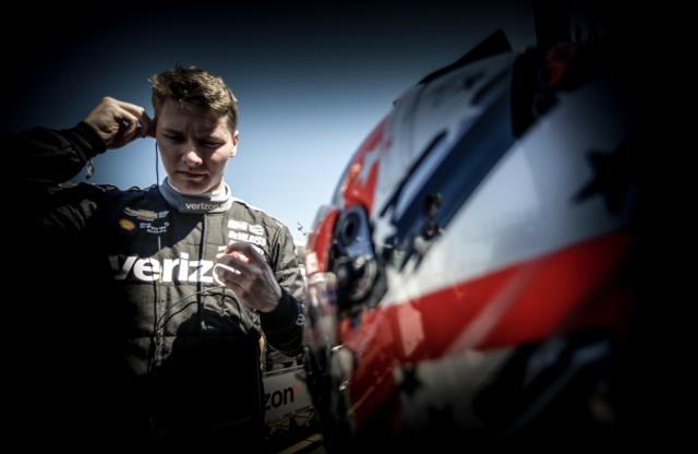 Josef Newgarden prepares his earpieces along pit lane prior to practice for the Firestone Grand Prix of St. Petersburg -- Photo by: Shawn Gritzmacher