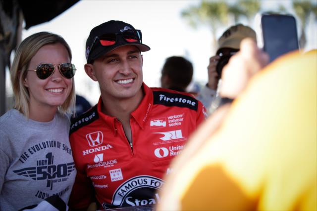 Graham Rahal poses for a photograph during the autograph session in the St. Petersburg Fan Village -- Photo by: Shawn Gritzmacher