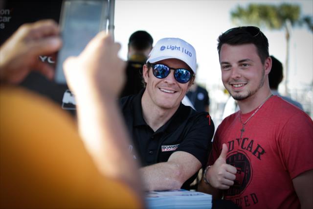 Scott Dixon poses for a photograph during the autograph session in the St. Petersburg Fan Village -- Photo by: Shawn Gritzmacher