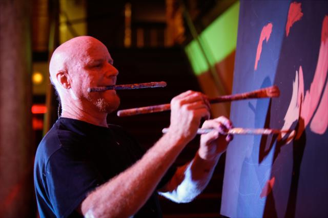 Speed painter Dale Henry applies his craft to a portrait during the kickoff welcoming celebration in St. Petersburg -- Photo by: Shawn Gritzmacher