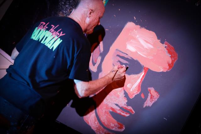 Speed painter Dale Henry applies his craft to a portrait of Simon Pagenaud during the kickoff welcoming celebration in St. Petersburg -- Photo by: Shawn Gritzmacher