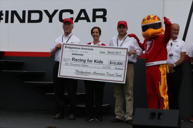 Firestone presents Racing for Kids a check for $10,000 during the 2017 Firestone Grand Prix of St. Petersburg. -- Photo by: Chris Jones