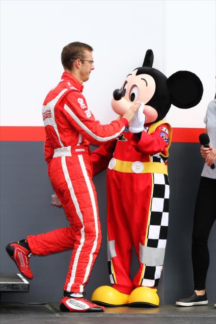 Sebastien Bourdais gets a high five from Mickey Mouse during introductions of the 2017 Firestone Grand Prix of St. Petersburg. -- Photo by: Chris Jones